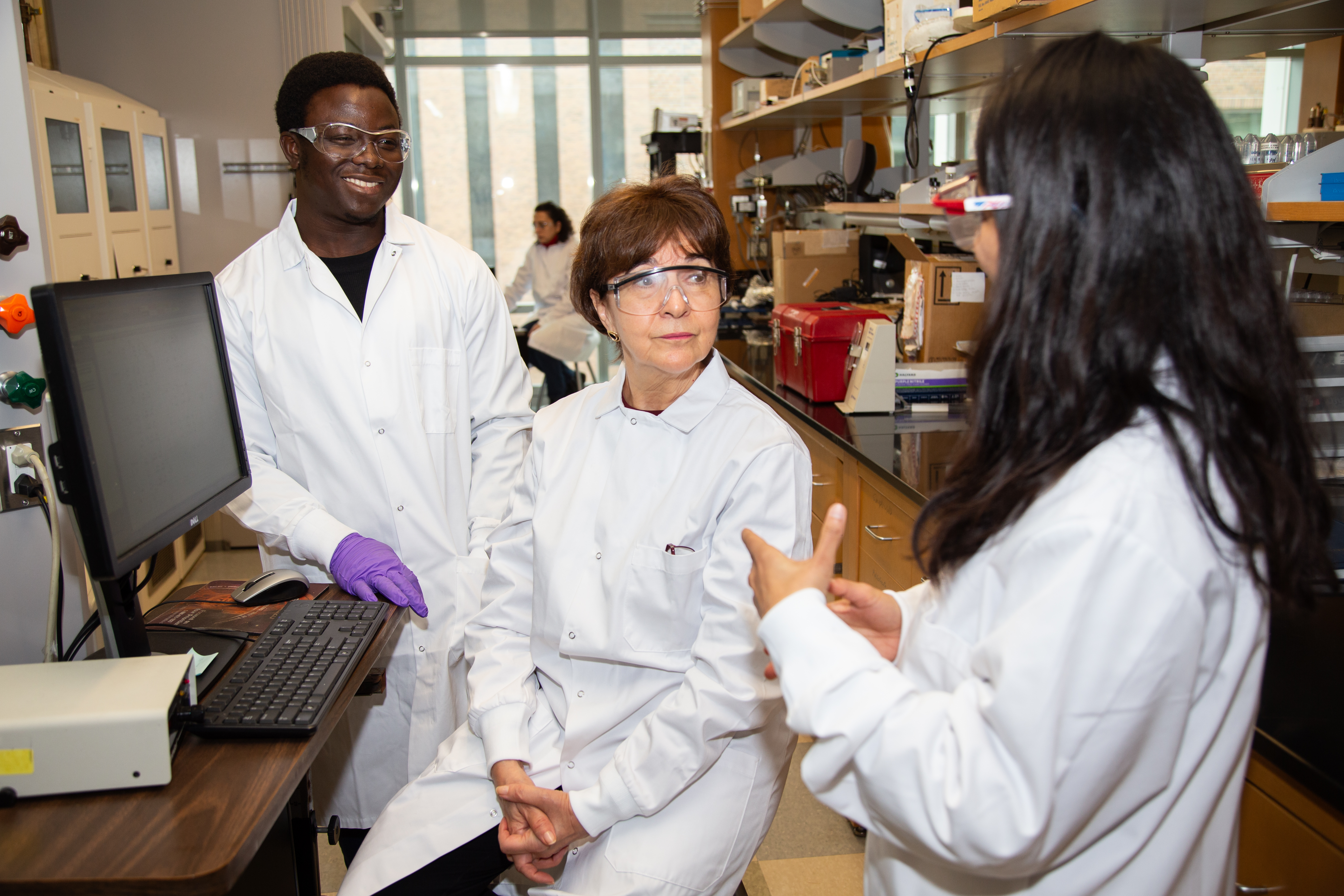 Students listen to research mentor