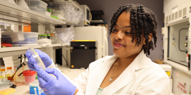 Jaleea Gamble observes research with a smile