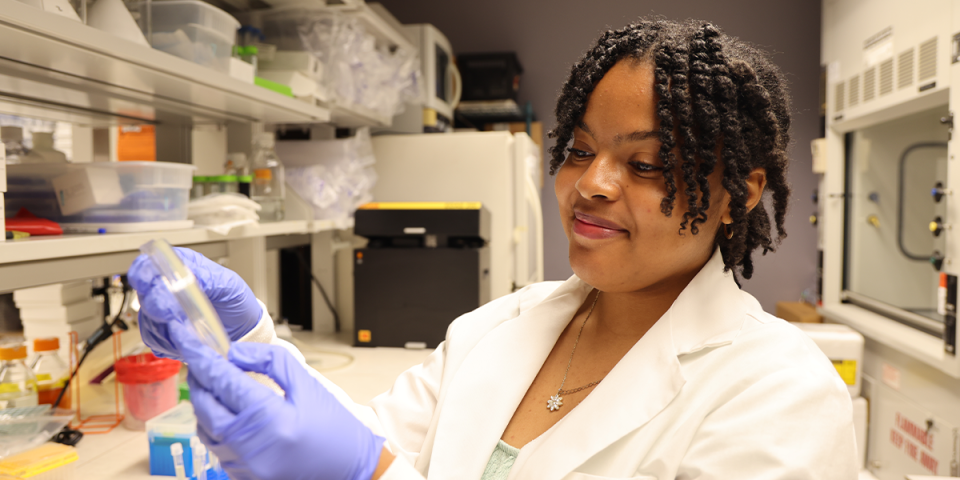Jaleea Gamble observes research with a smile