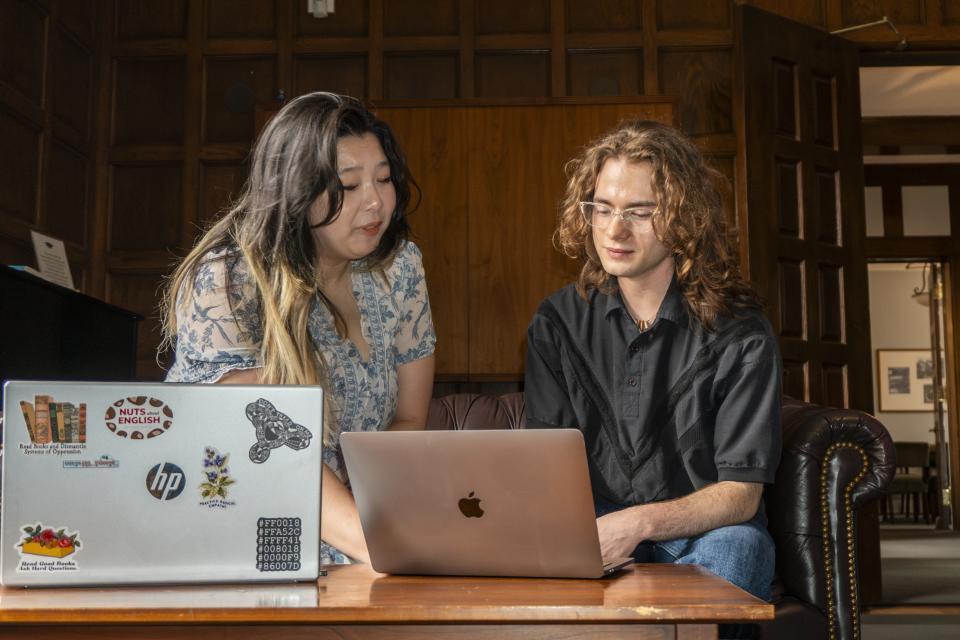 Students in Kuhn looking over the computer